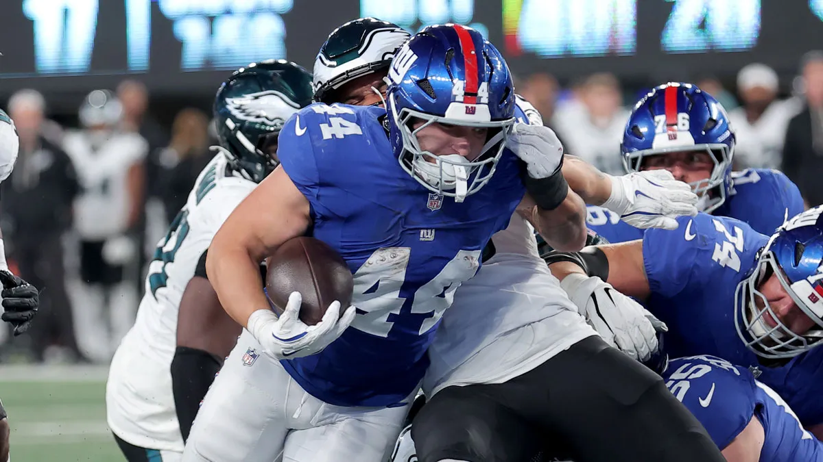 Giants-running-back-Cam-Skattebo-runs-with-the-ball-for-a-touchdown-against-the-Philadelphia-Eagles.webp