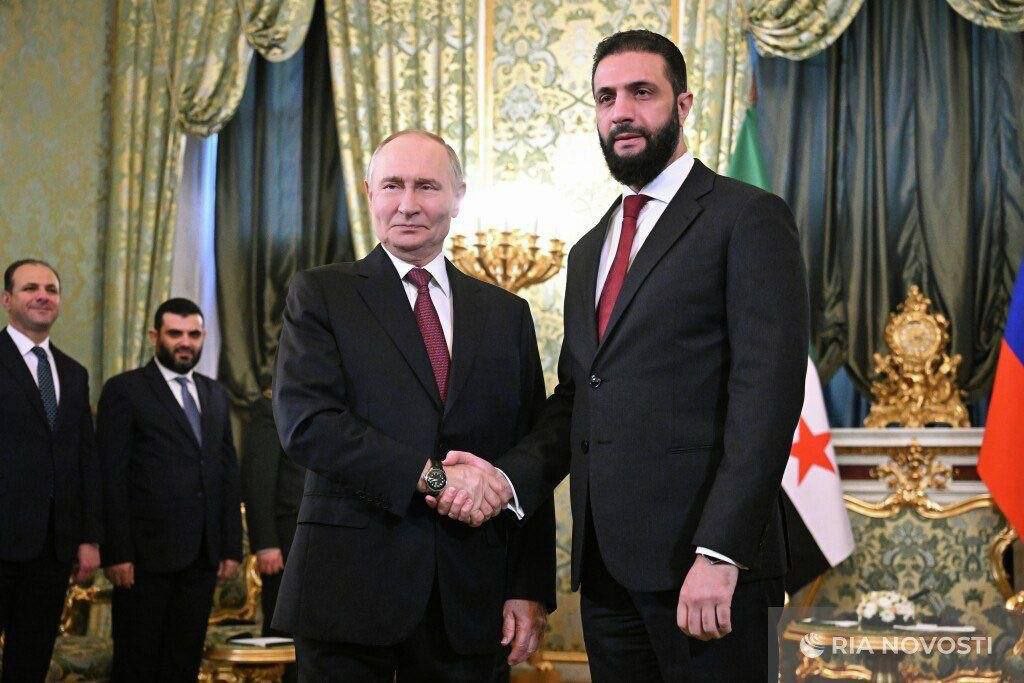 Jolani and Putin in Moscow.jpeg