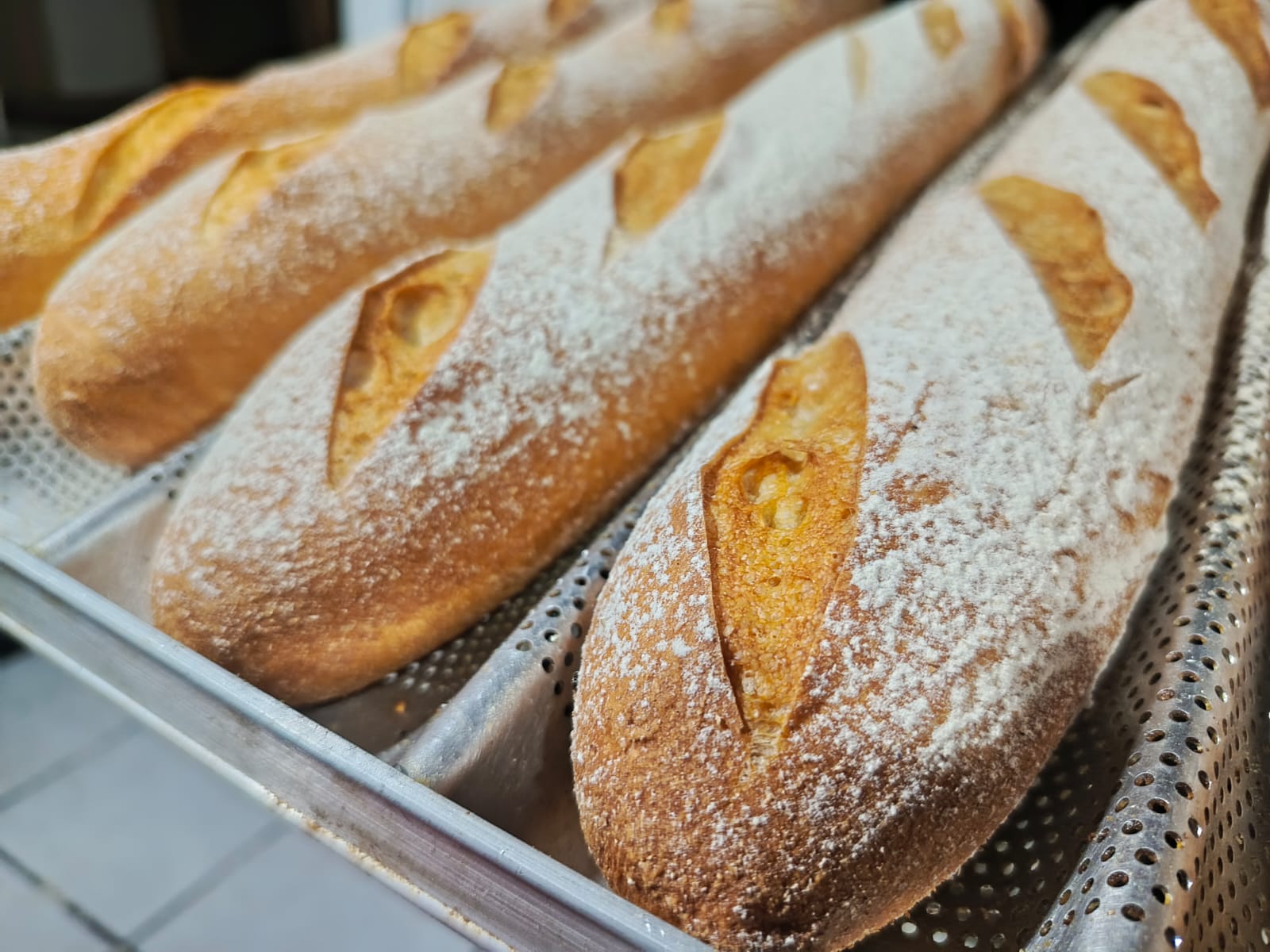 One of our newer bread pictures, as requested. We worked a lot on the baguettes recently, and they're even better now.