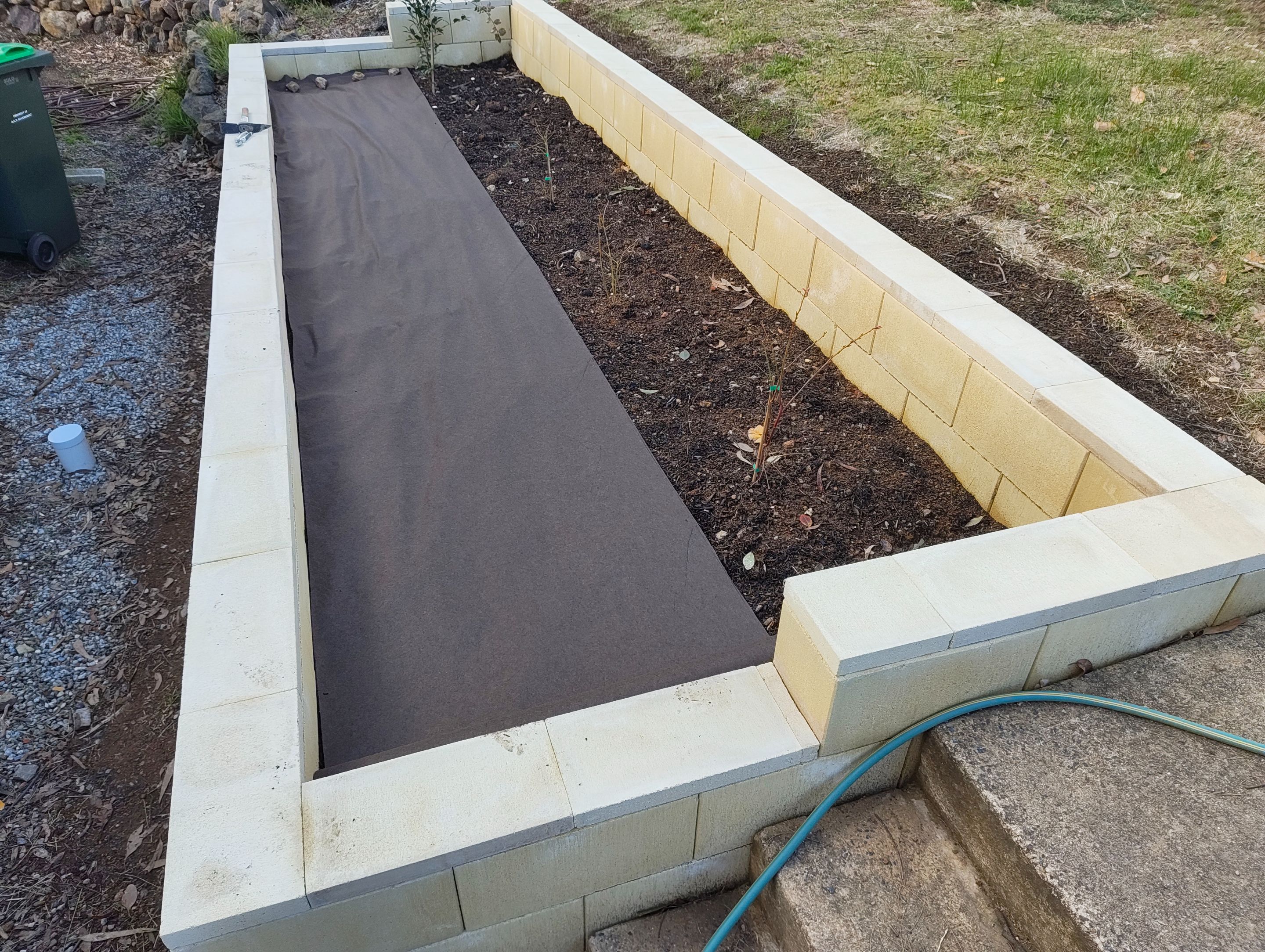 Weed-Matting the Walled Area.jpg