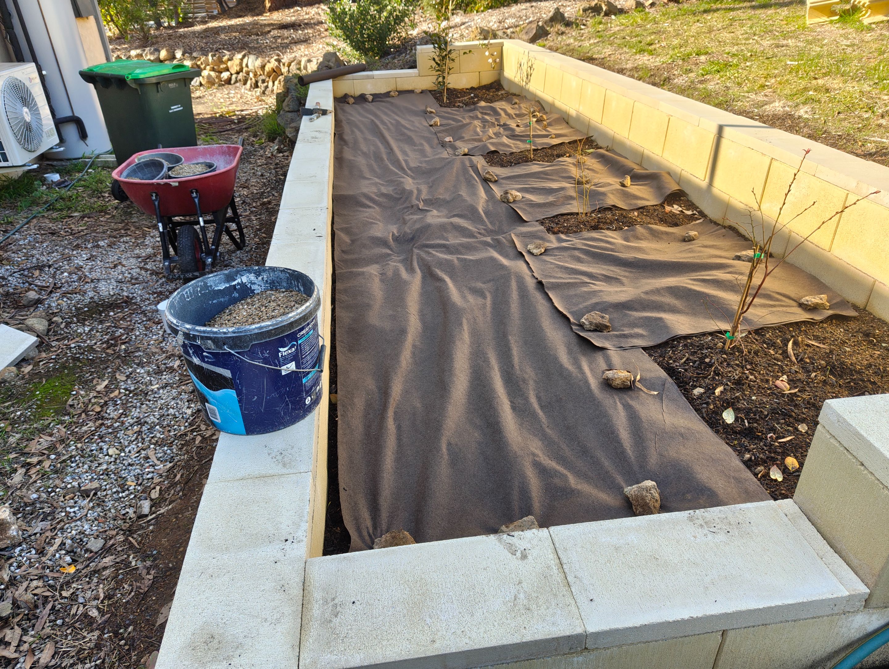 Weed-Matting the Walled Area.jpg
