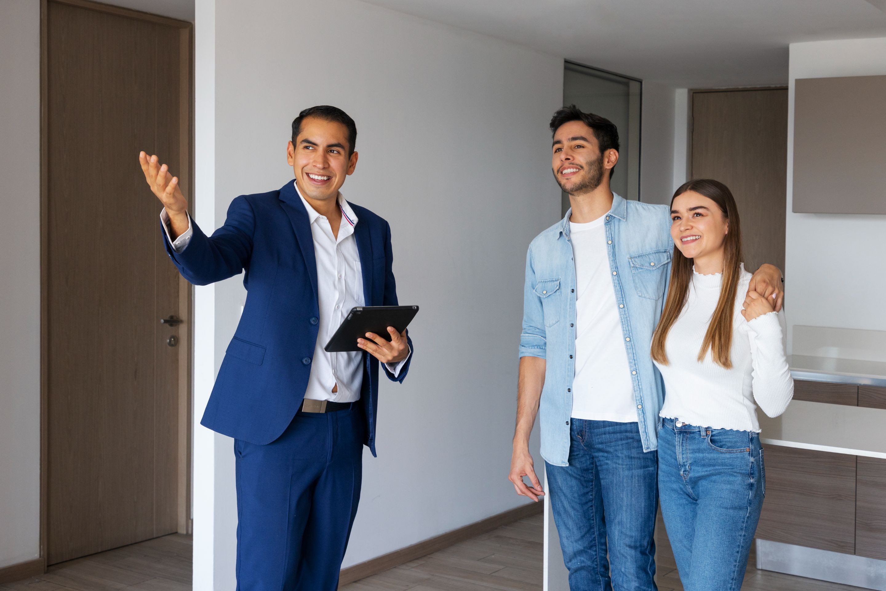 medium-shot-couple-talking-real-estate-agent.jpg