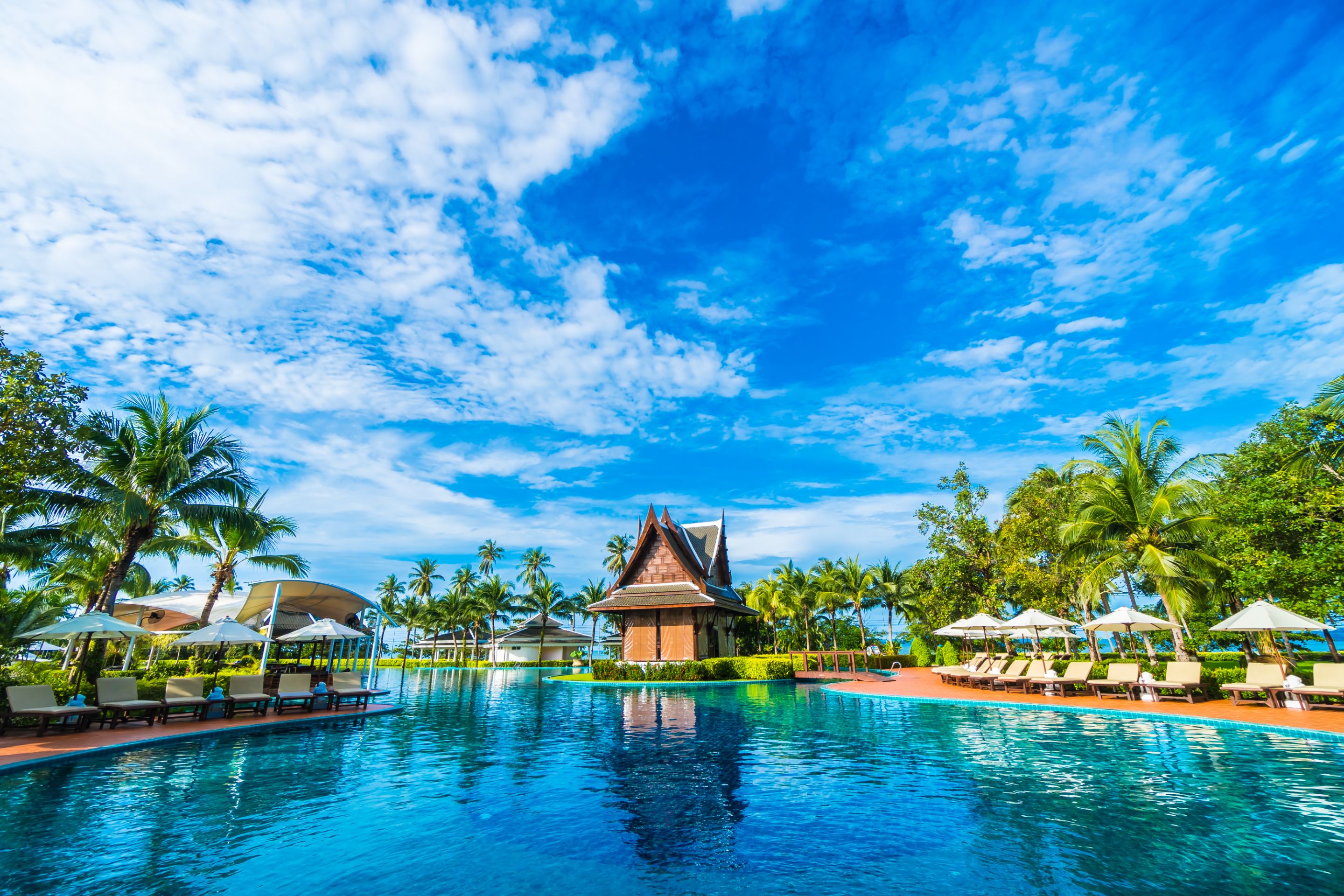 umbrella-chair-around-swimming-pool.jpg
