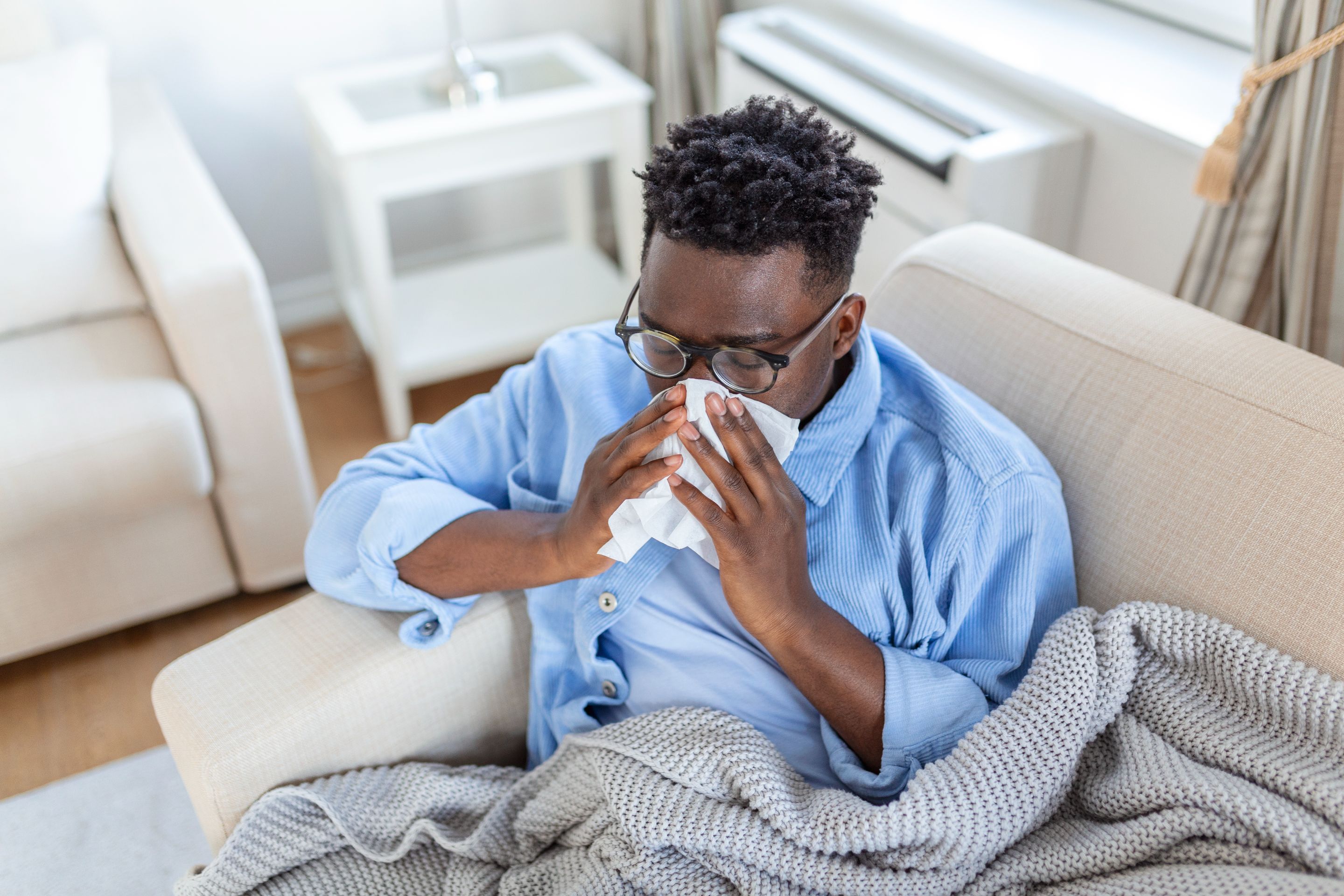 portrait-sick-man-with-flu-allergy-germscold-coughing-sick-man-with-headache-sitting-blanket-with-high-fever-flu-resting-drinking-hot-beverage.jpg