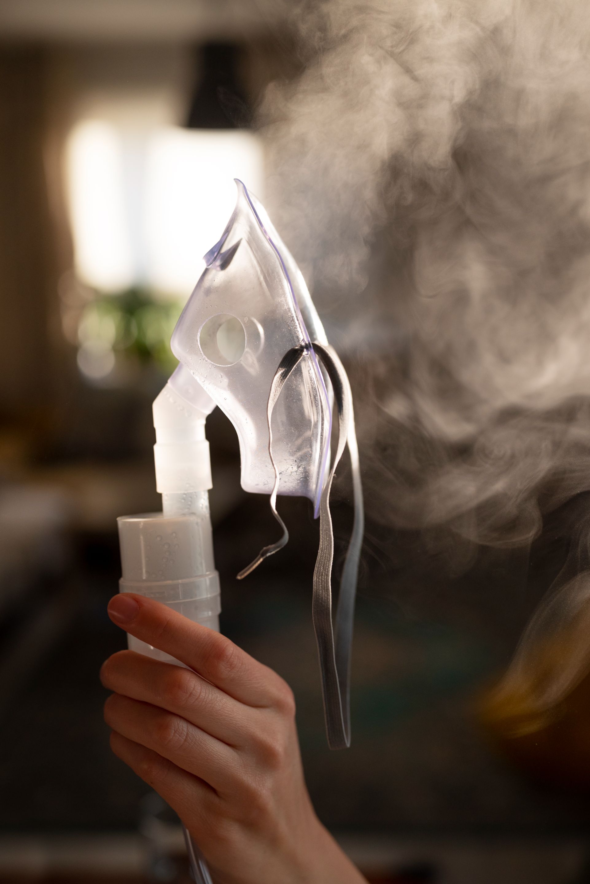side-view-adult-holding-nebulizer.jpg