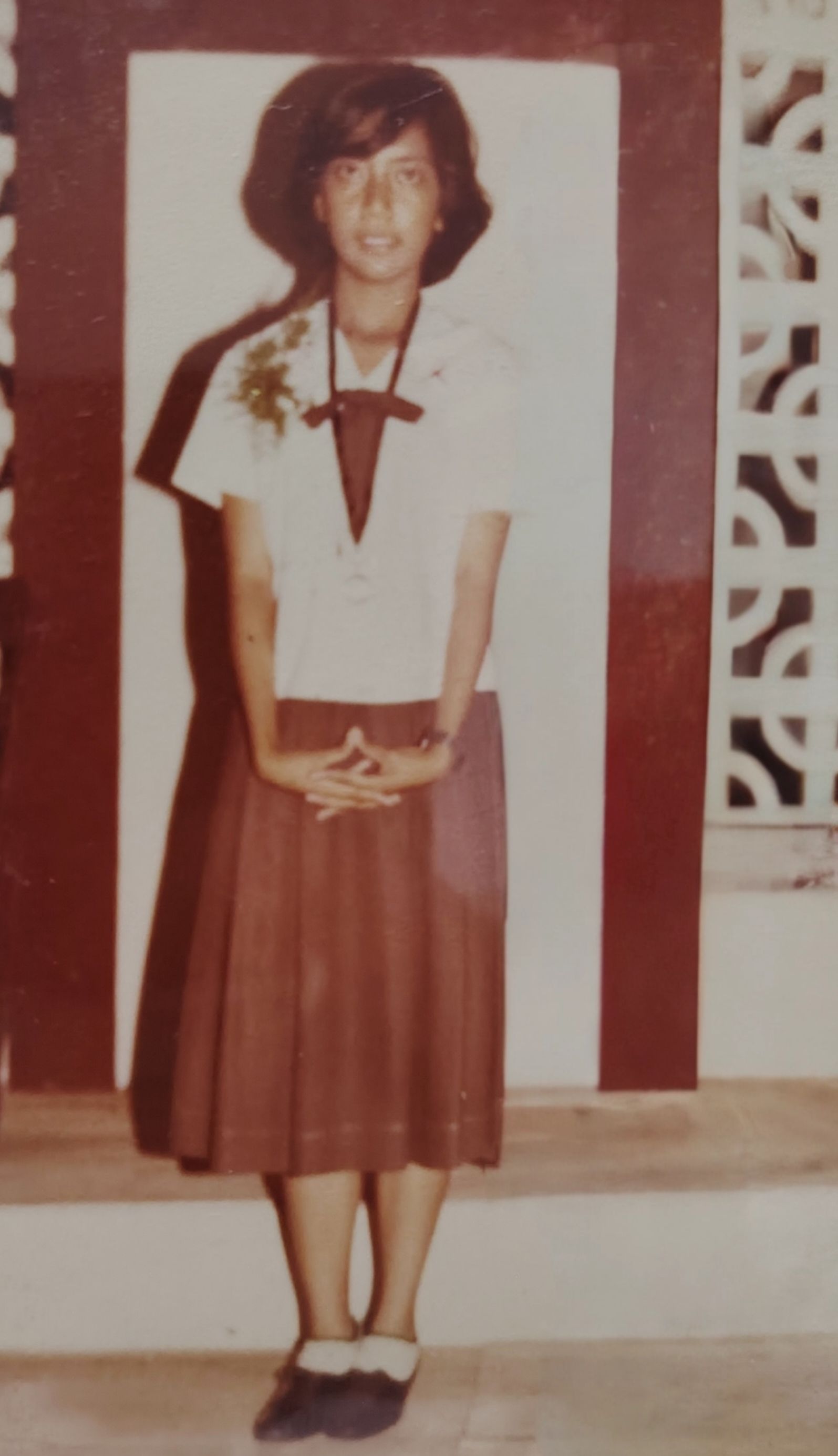 On stage during my high school graduation — proud, nervous, and happy all at once.