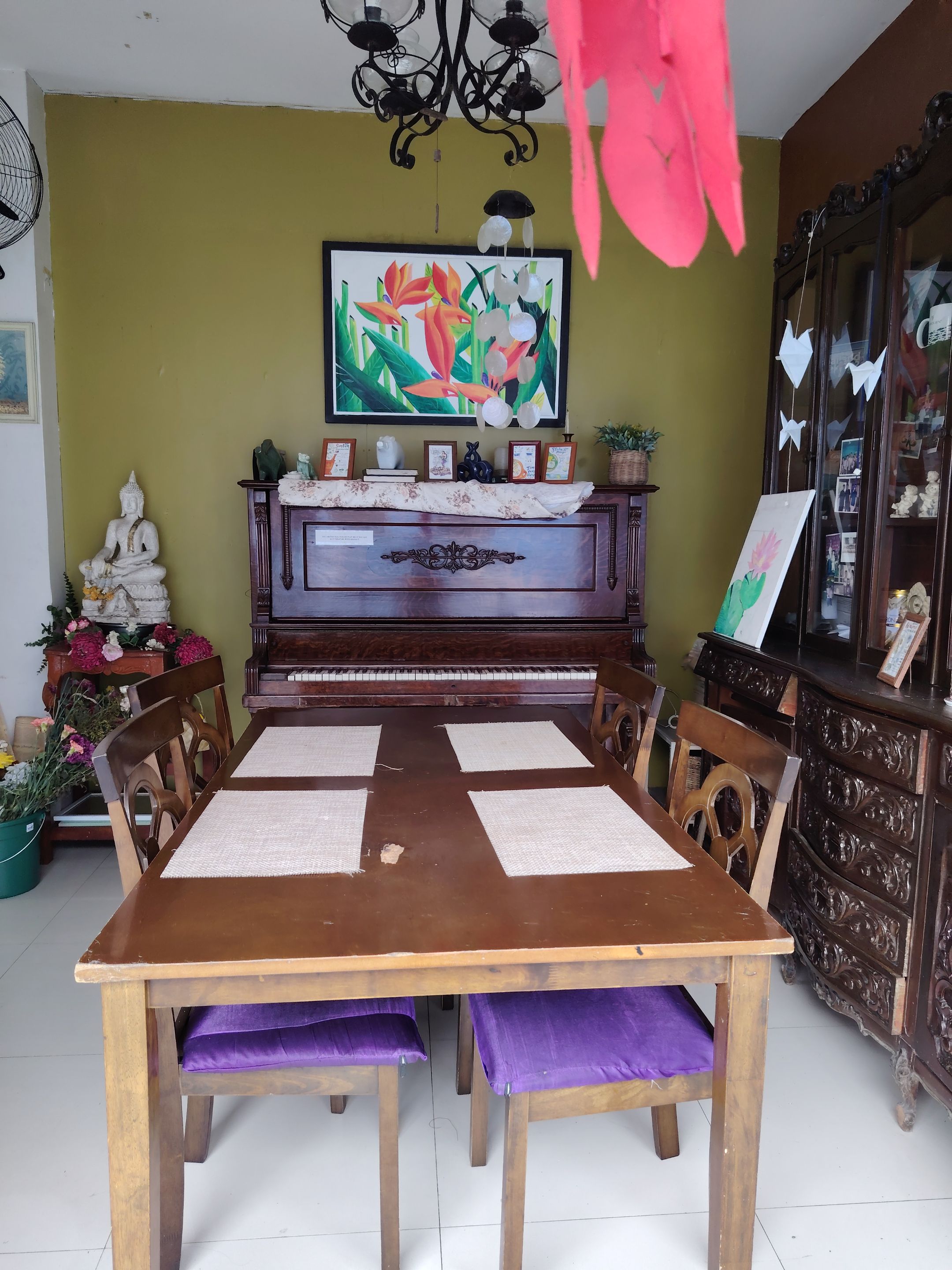 Simple dining setup with an old piano