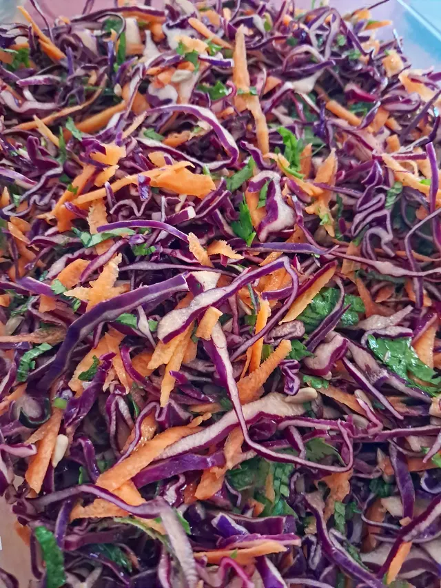 Rainbow slaw: red cabbage, carrot, mint, coriander and sunflower seeds, with a lime dressing