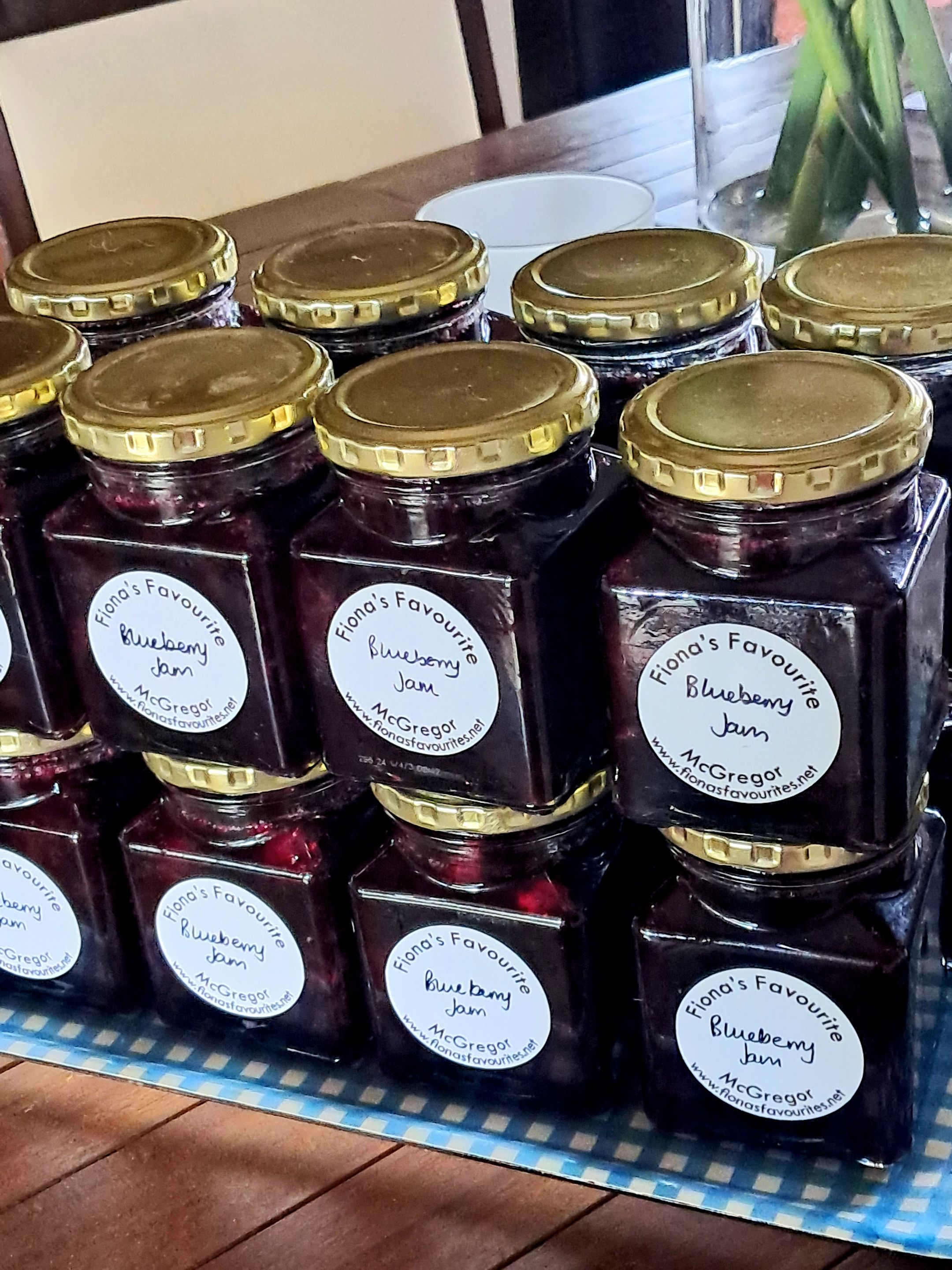 Nineteen jars of blueberry jam:  potted, labelled and ready for the market.