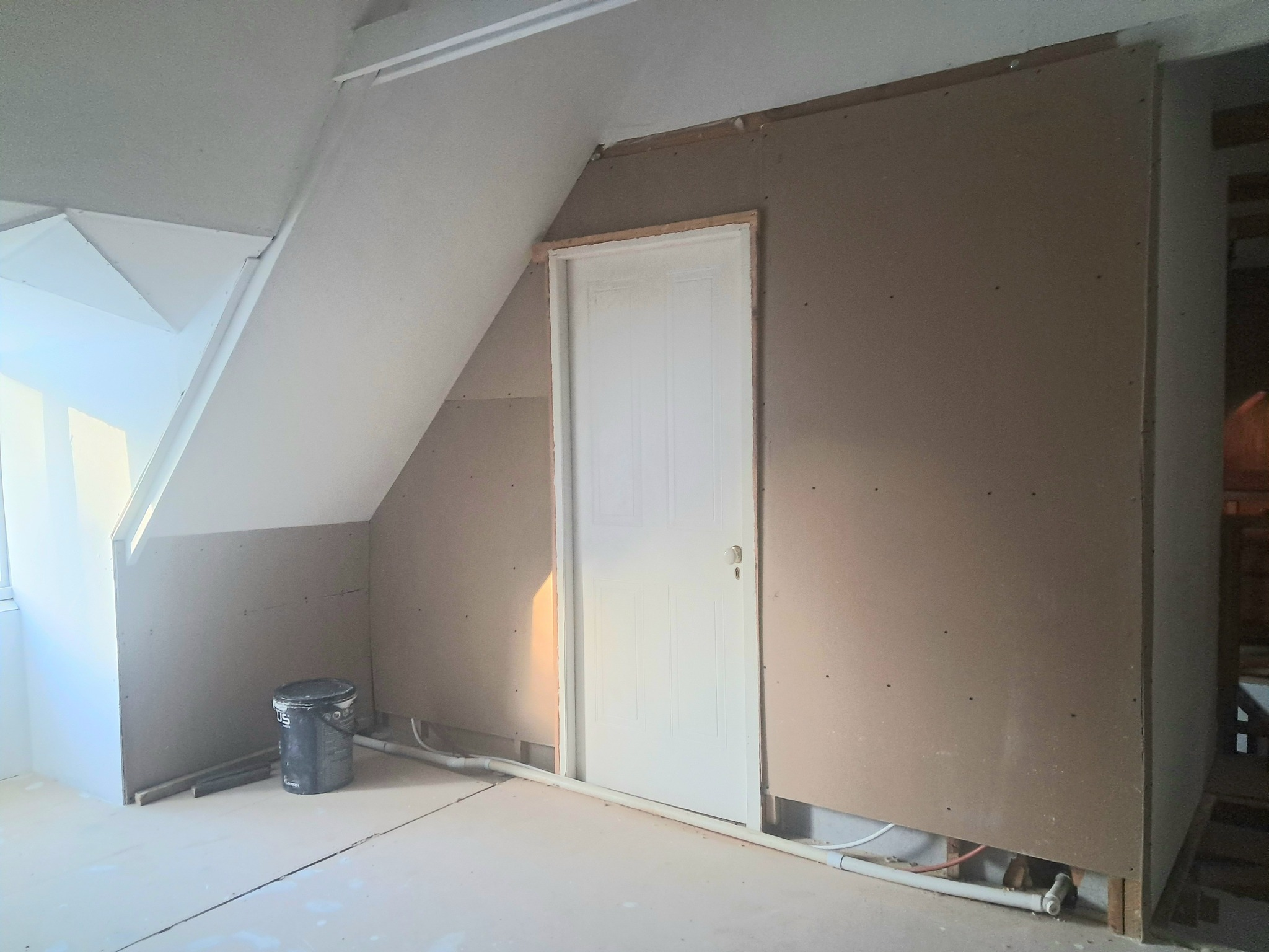 Outside the bathroom, door closed