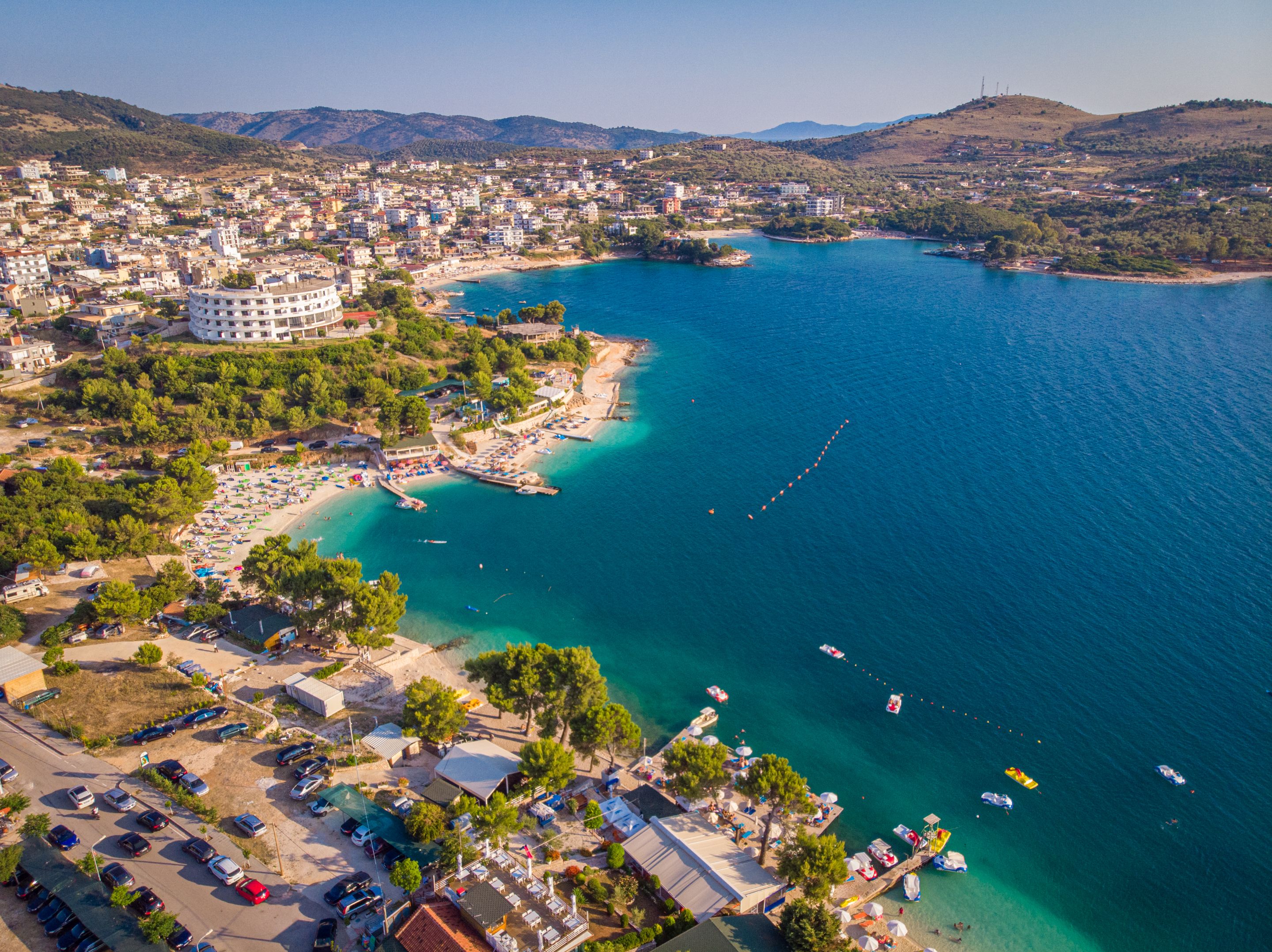 aerial-view-of-the-coastline-of-the-resort-town-of-ksamil-on-a-sunny-summer-day.jpg