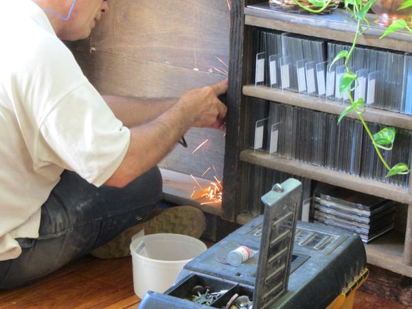 Shelf repair - John grinding off nails crop Oct 2025.jpg