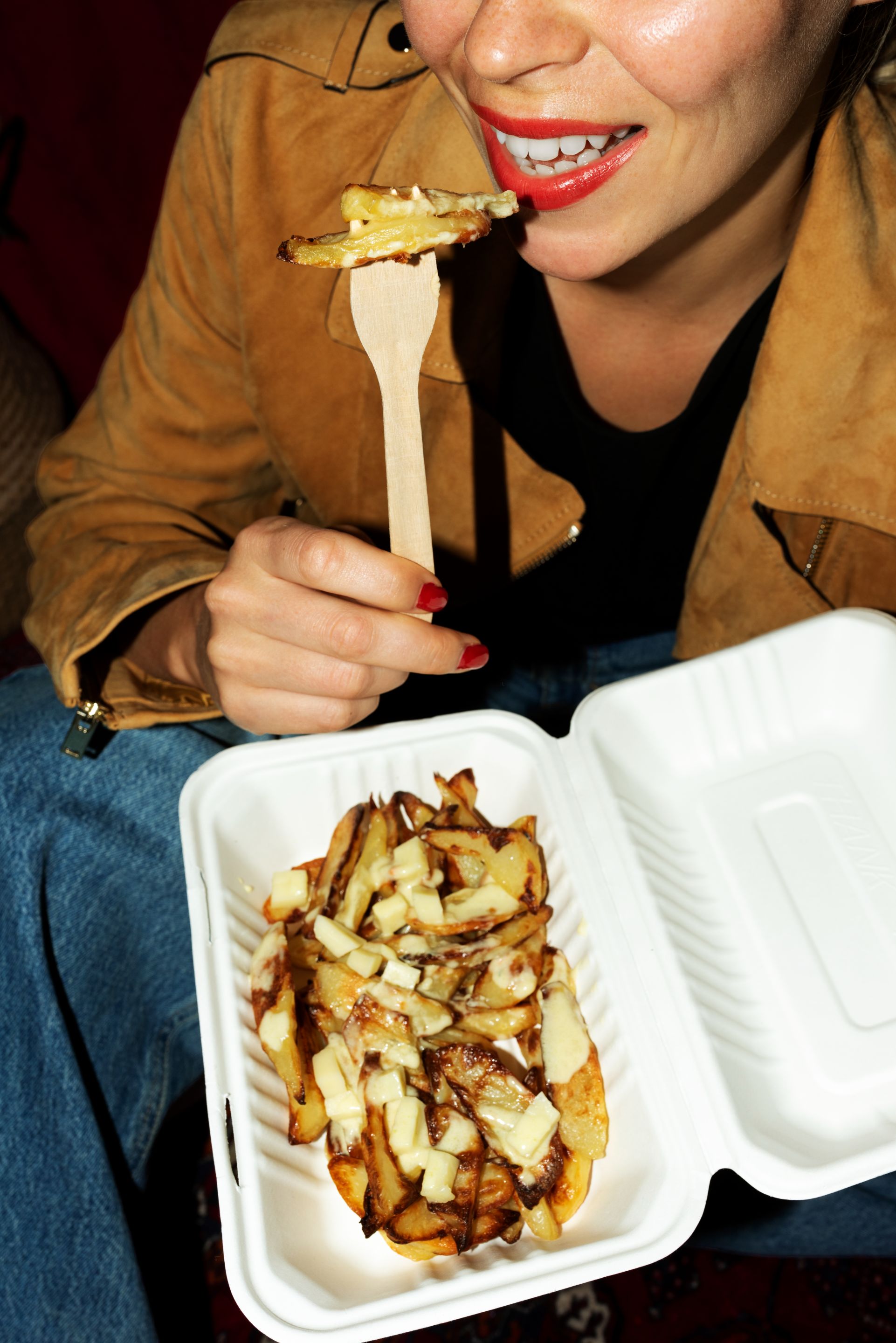 portrait-woman-eating-dish-poutine.jpg