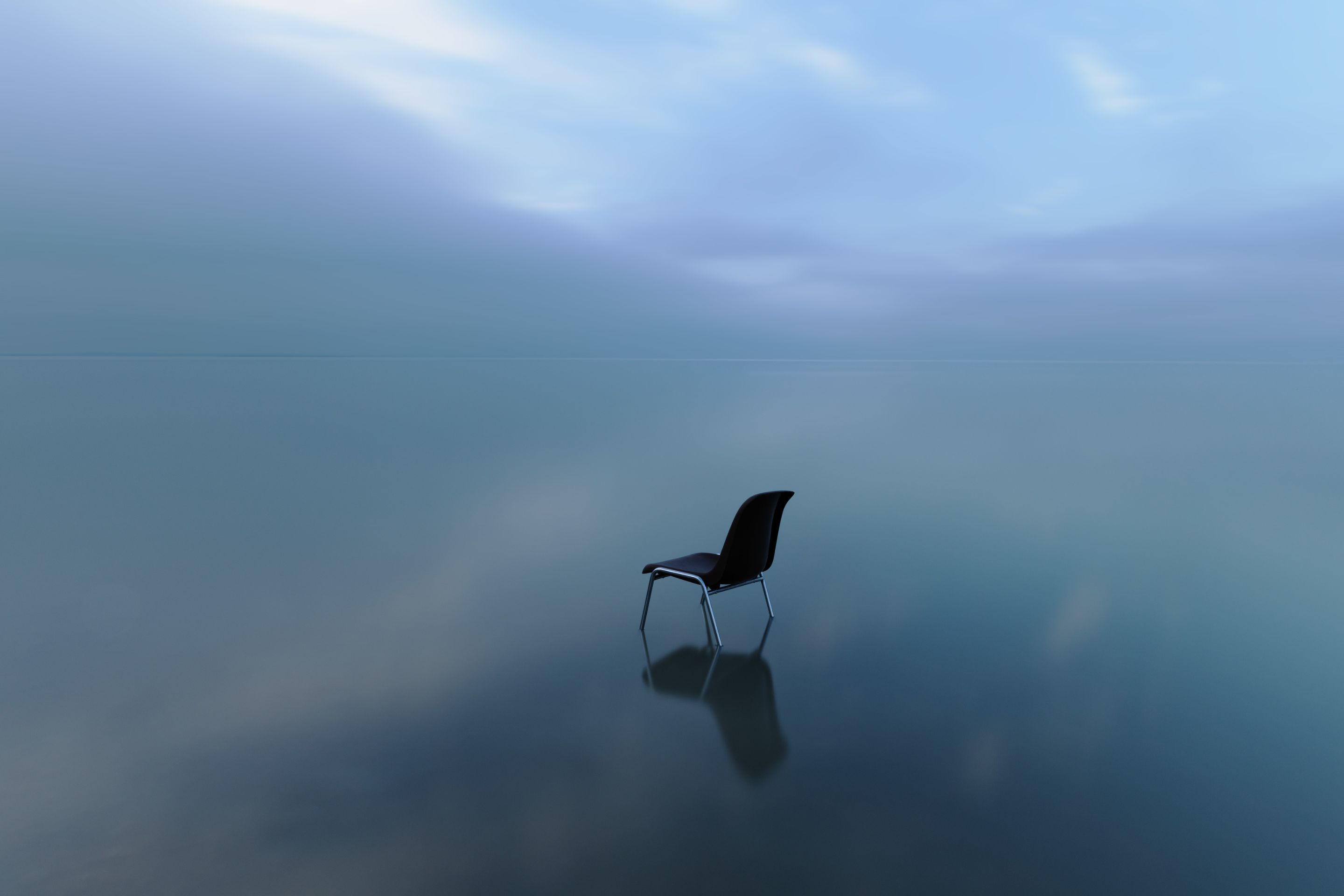 single-chair-reflecting-water-surface-stormy-day.jpg