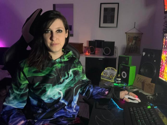 raven sitting at her home studio setup