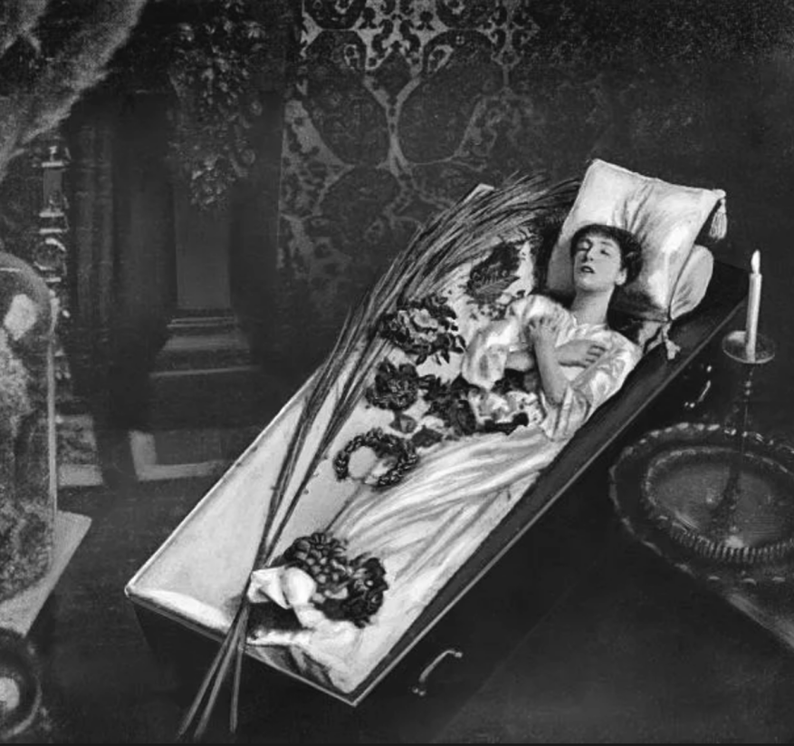 The ALIVE, (well, now dead) Sarah Bernhardt in a coffin, photographer unknown