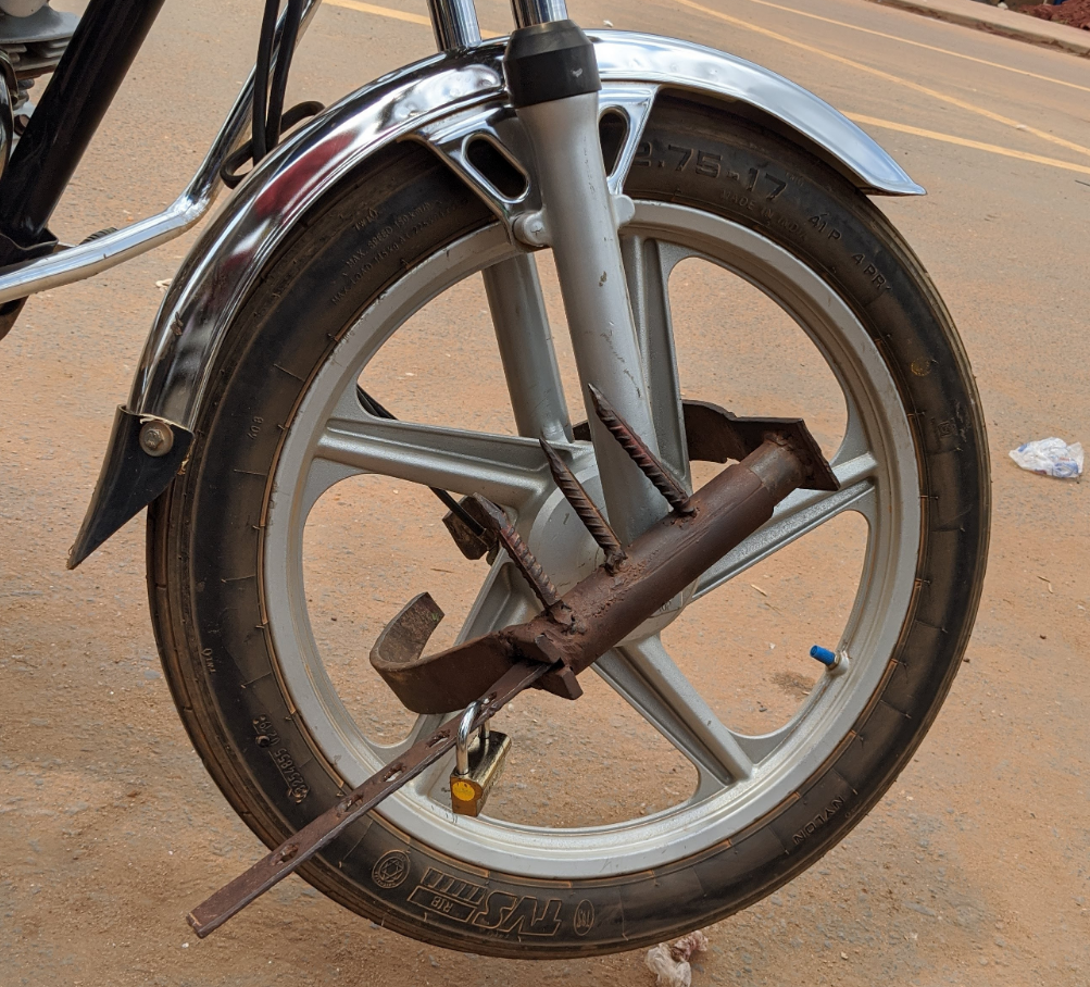 Welded boot placed on our motorbike.