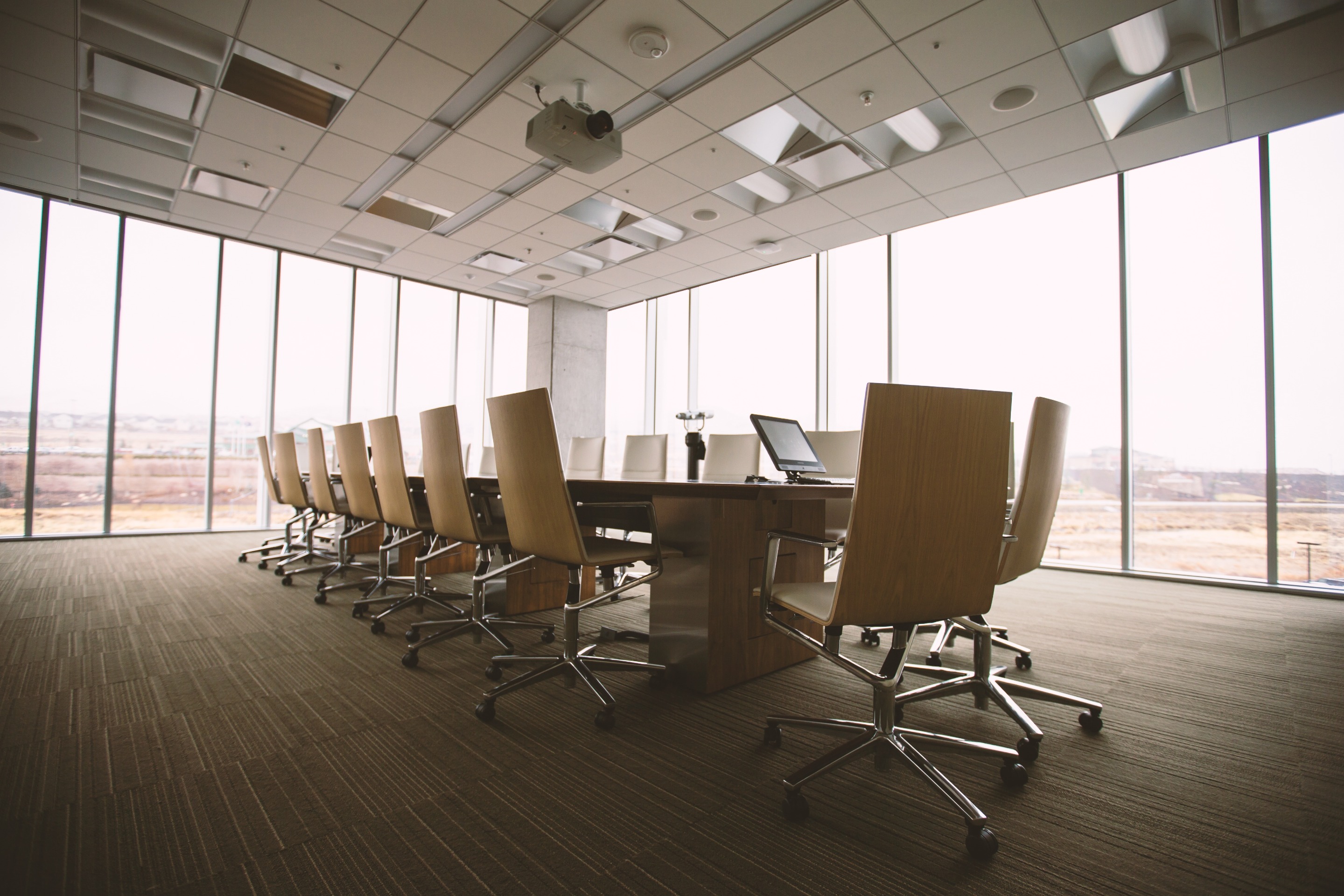 Canva Empty Boardroom with a Long Table.jpg