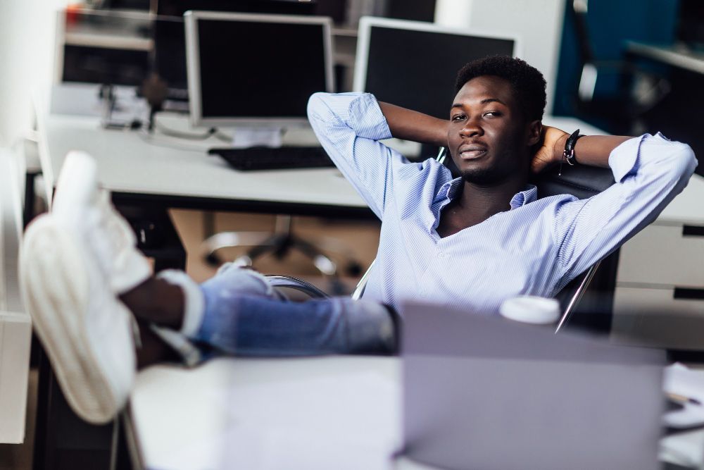 young-african-business-man-relaxing-his-office-time-forresting-after-working.jpg