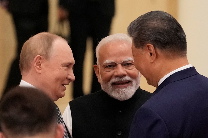 Putin, Modi and Xi share a moment.jpg