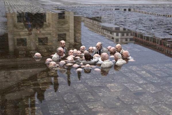 isaac cordal politician discussing global warming.jpeg
