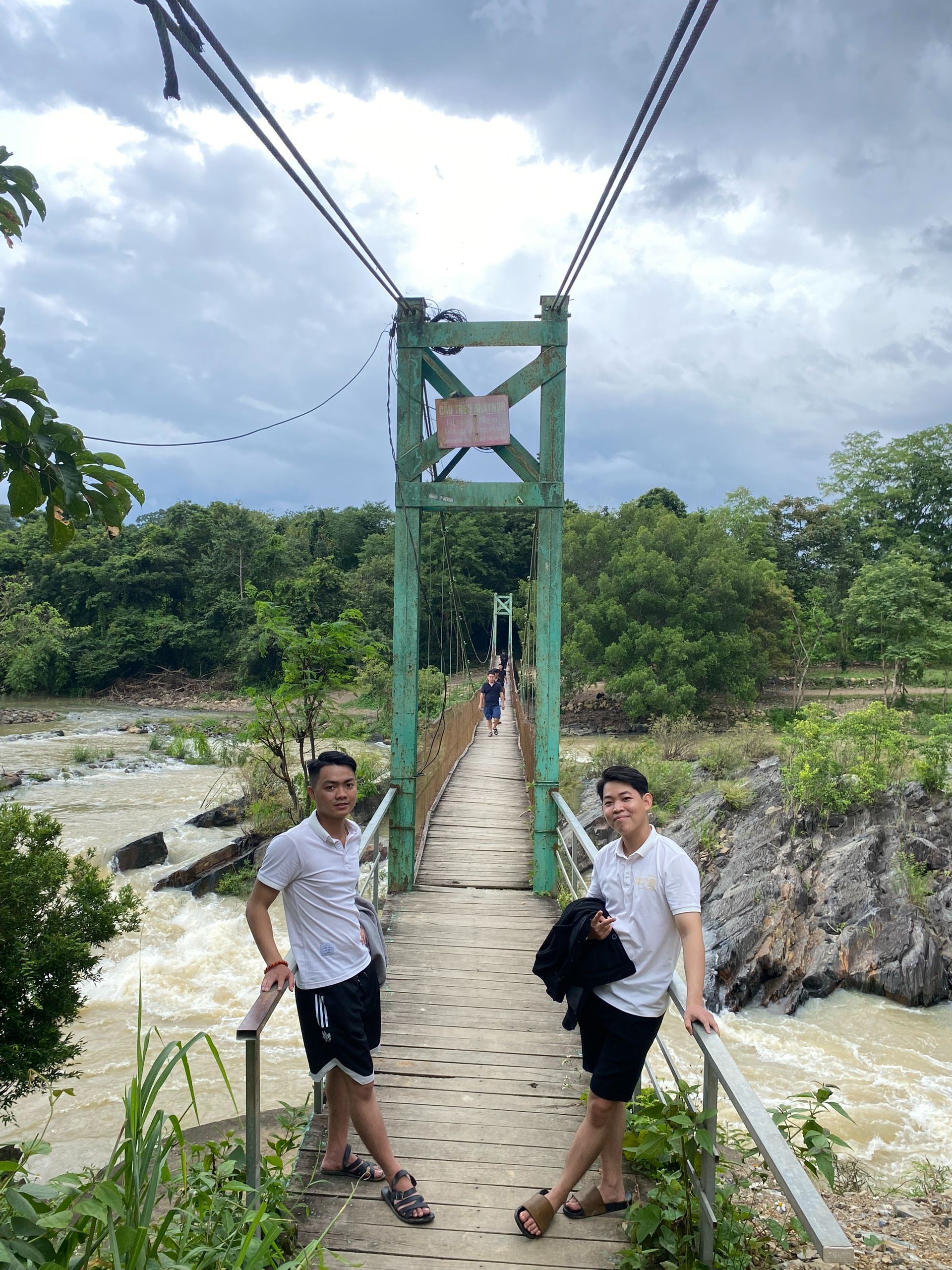 The bridge crosses the end of the waterfall