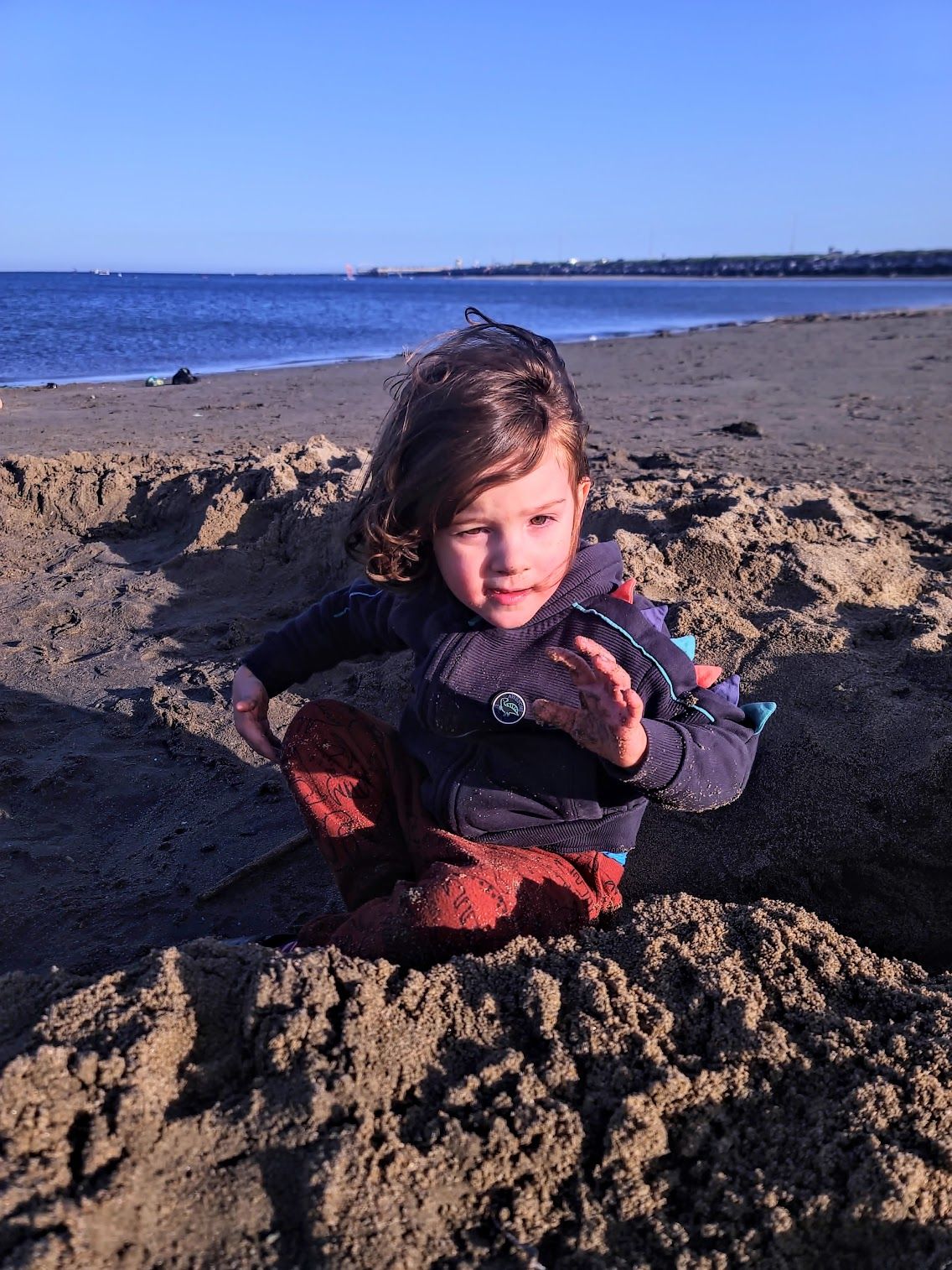 Getting tired of the sand at this point. He got some in his eyes and was not happy!