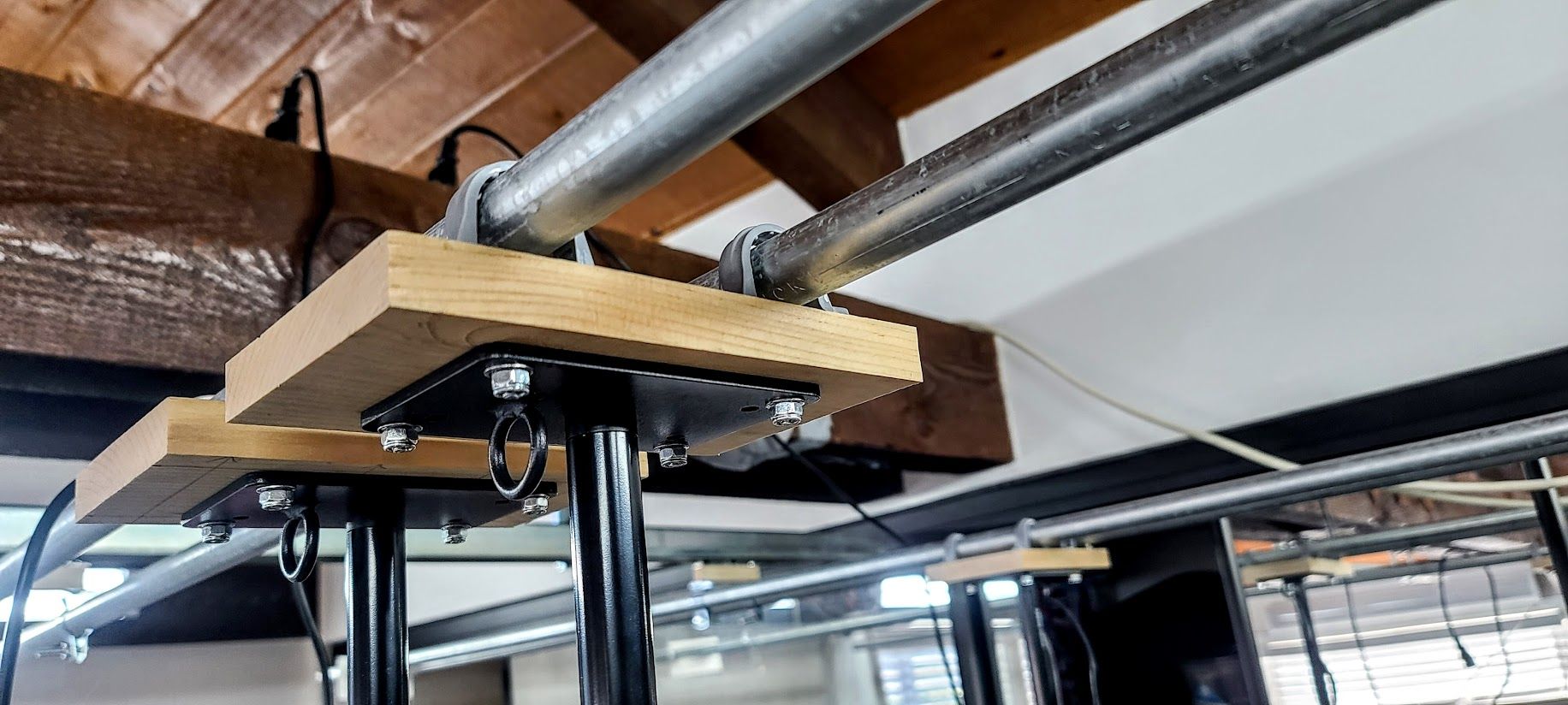 My homemade sliding brackets from which the lights hang