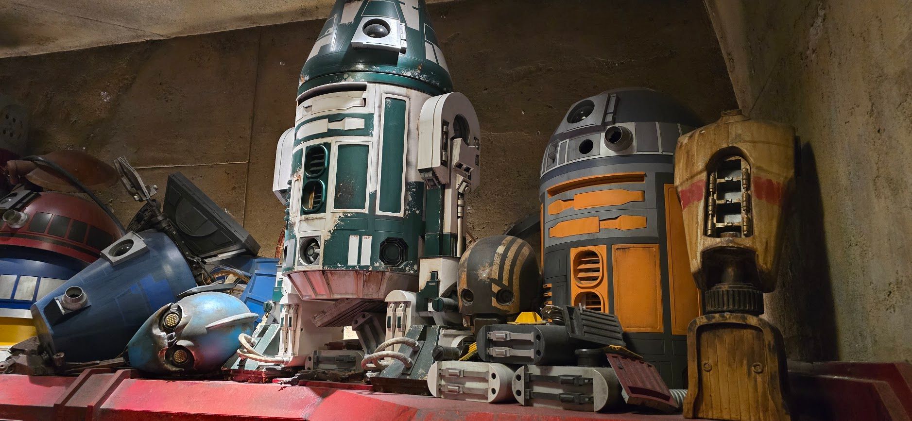 Broken droids sitting above the droid parts conveyor belt