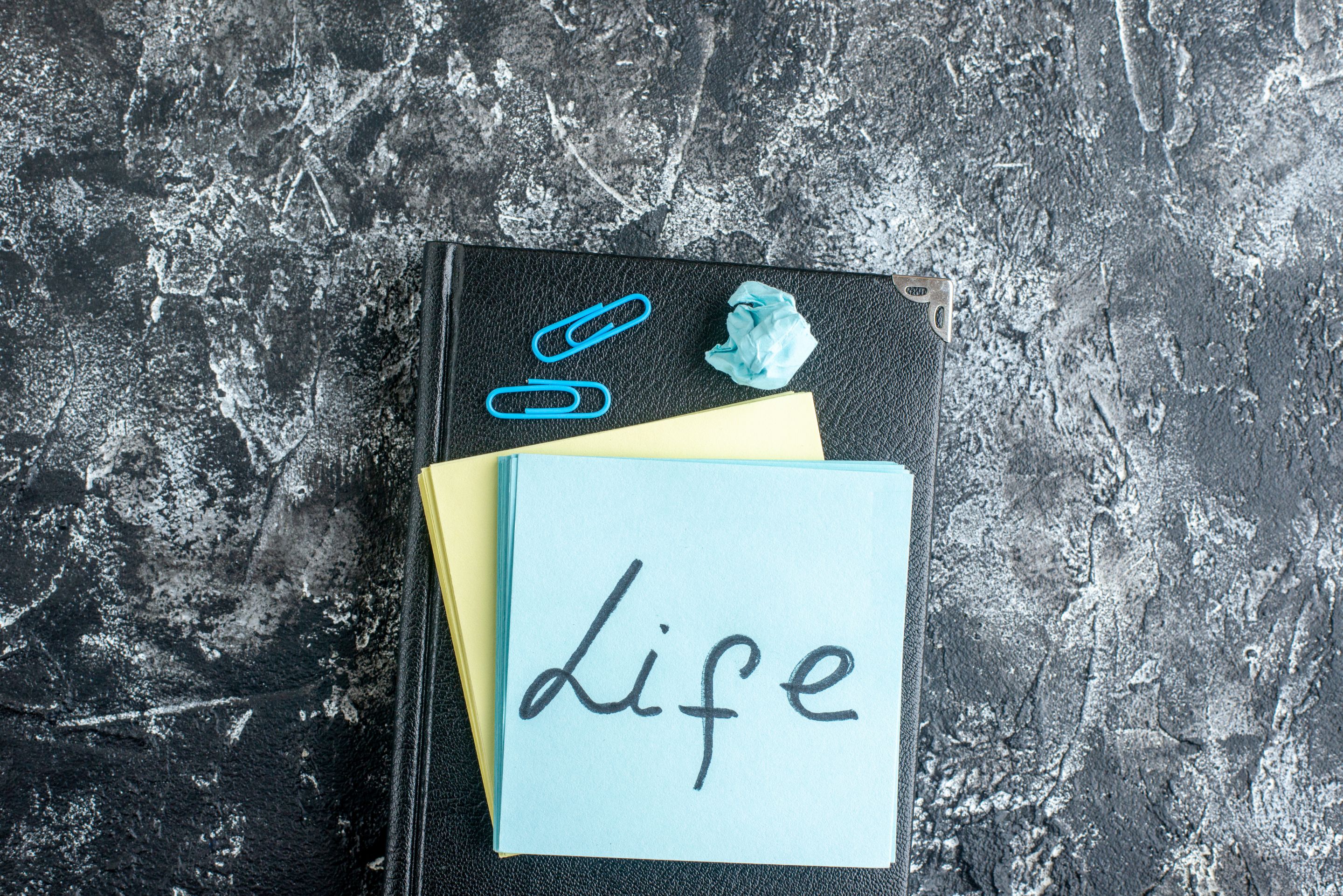 top-view-life-written-note-gray-background.jpg