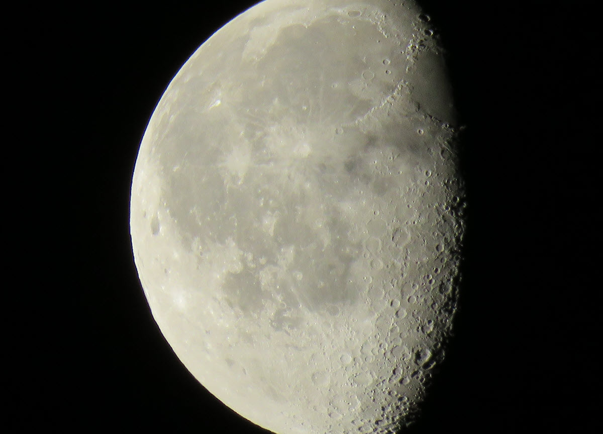 close up half moon showing details on surface.JPG