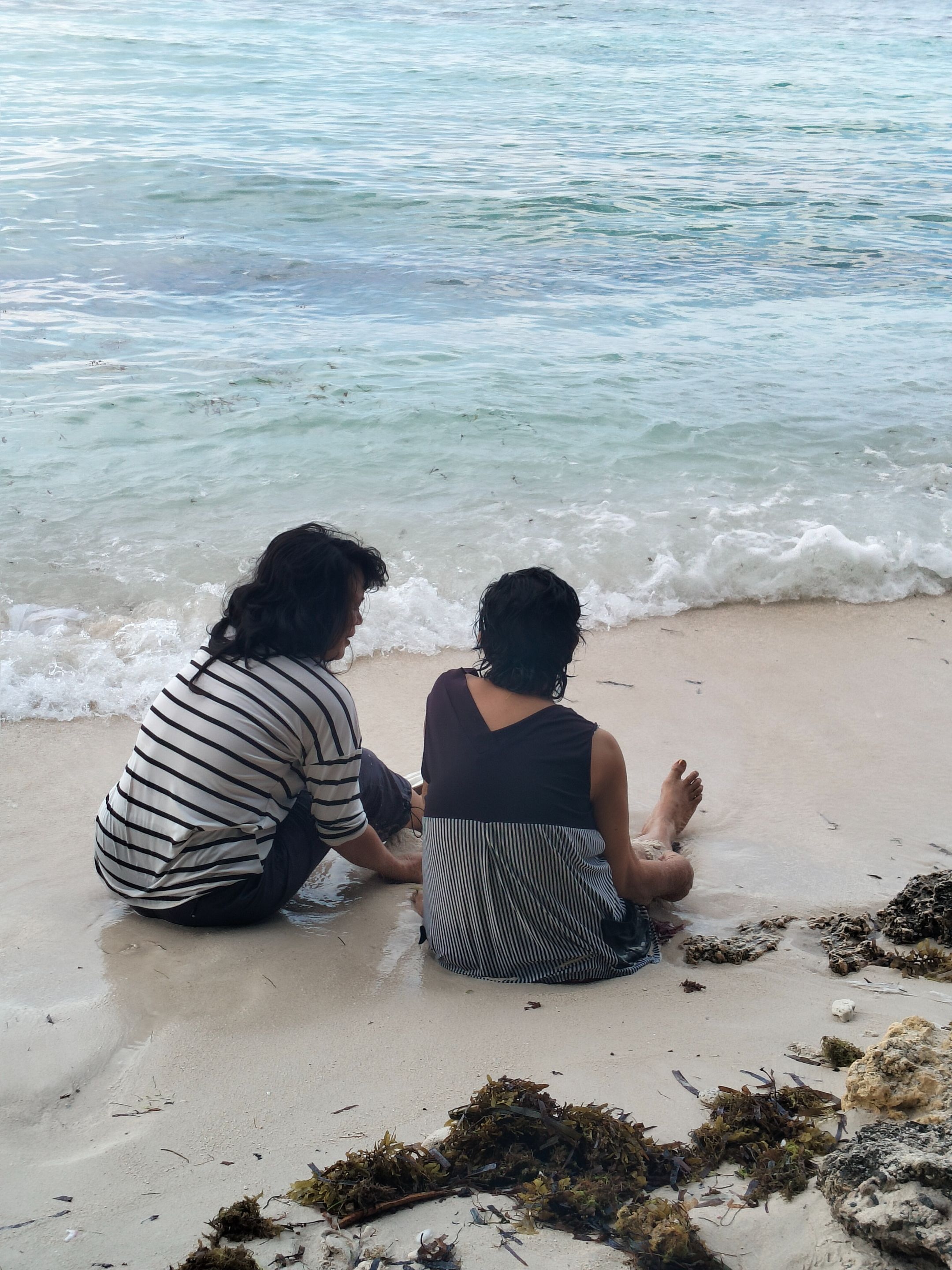 One of my lola's last few beach trips, sitting beside her is my ma