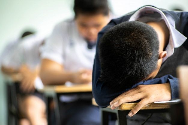 Premium Photo _ Asian students sleep on the table in classroom,test or exam concept.jpeg