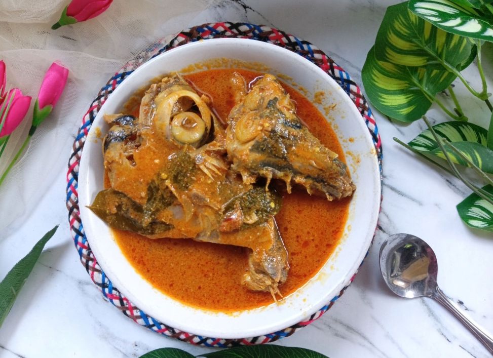 Cooking tuna fish curry for family lunch at home