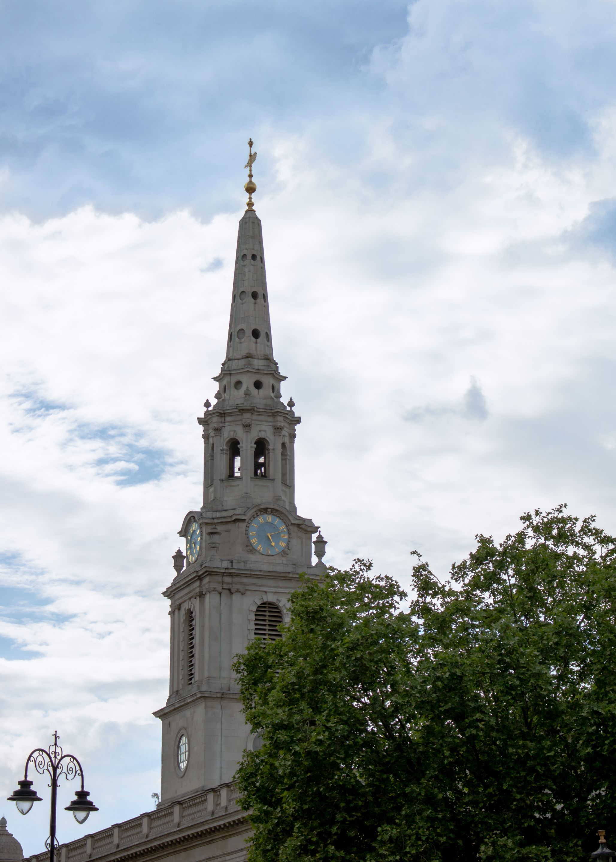 Church clock tower with a cloudy background sky.jpg