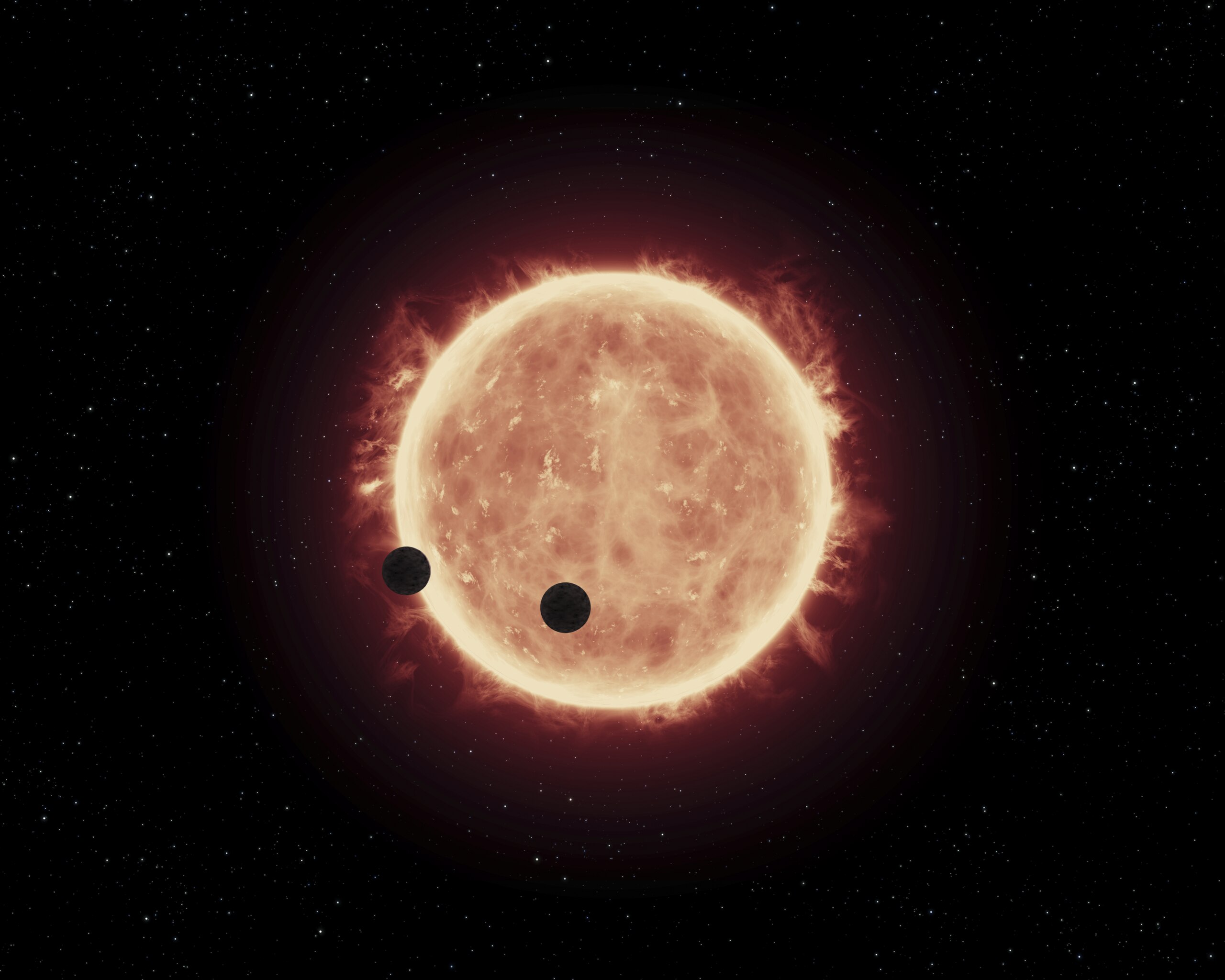 Artist's View of Planets Transiting Red Dwarf Star in TRAPPIST-1 System. Illustration:  Illustration: NASA, ESA, and G. Bacon (STScI); Science: NASA, ESA, and J. de Wit (MIT), Public domain, via Wikimedia Commons.