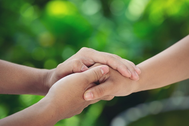 couple-holding-hands-green-meadow_1150-26188.jpg