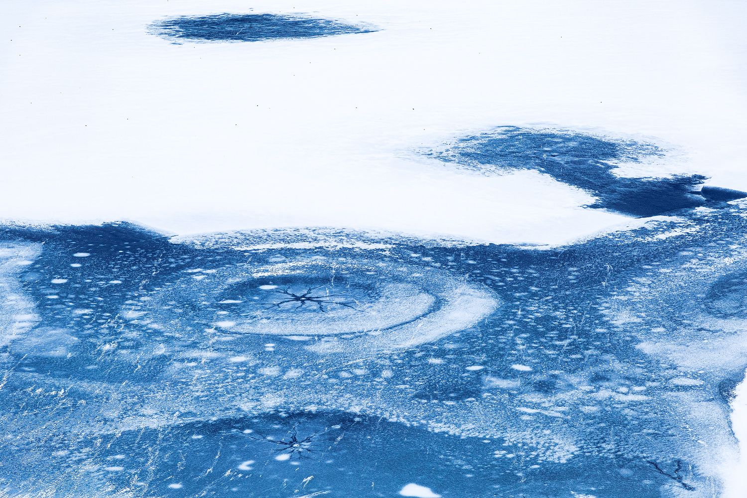 Frozen-lake-ice-patterns-winter-wonderland.jpg