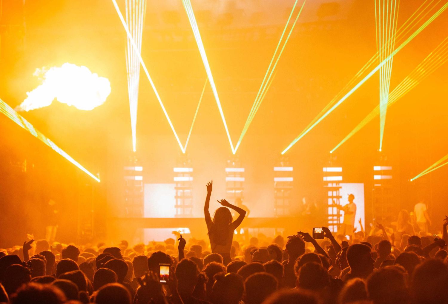 beautiful-shot-live-concert-performance-with-yellow-light-show-big-crowd-cheering.jpg