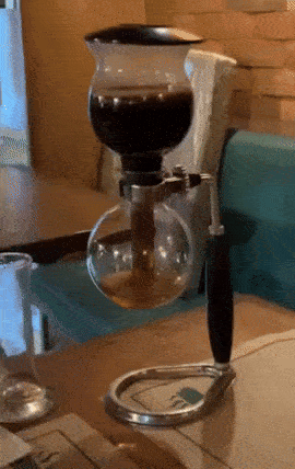 after the coffee saturates the grounds, it travels back into the bottom chamber
