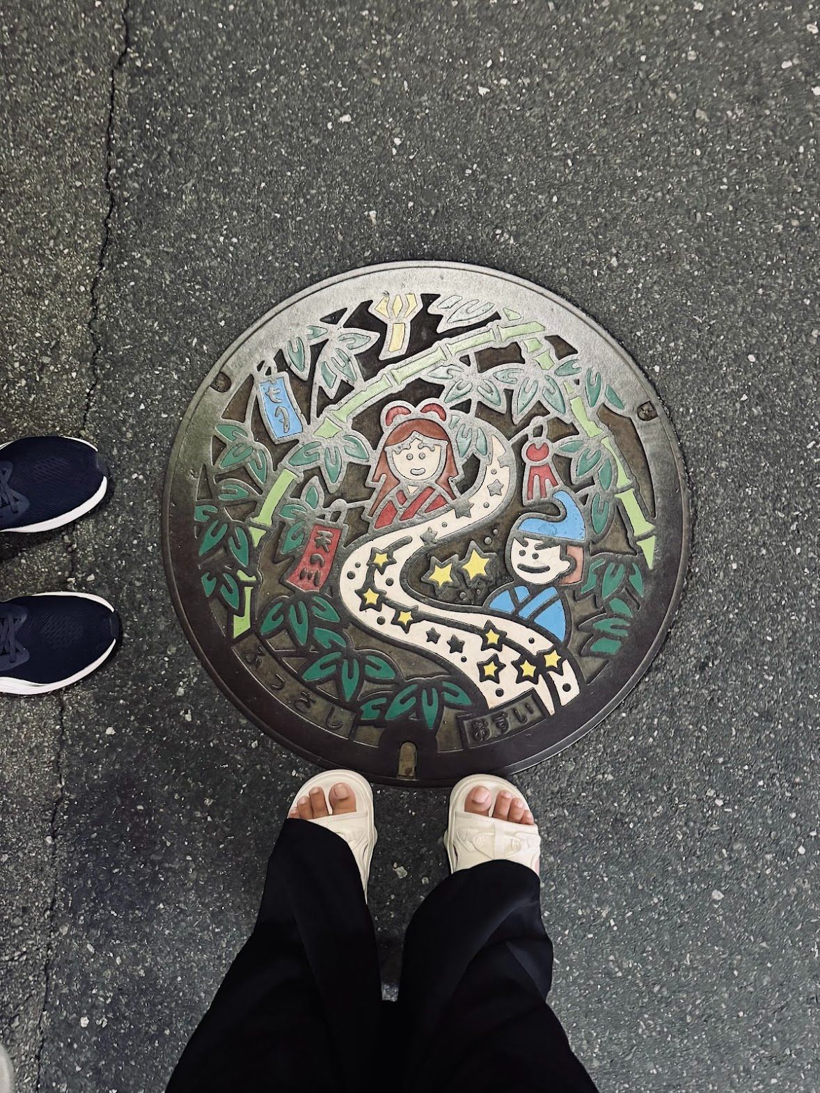 a colorful manhole cover of Fussa - is this Orihime?